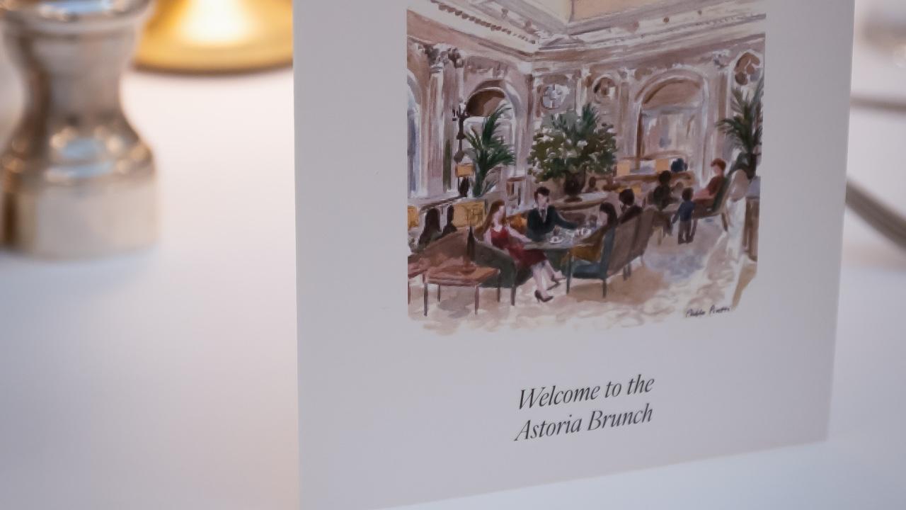 Elegant crystal chandeliers and white-draped tables in the Salon Elisabeth at Corinthia Grand Hotel Astoria Brussels