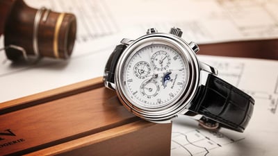 Blancpain Villeret complete calendar moon phase watch in yellow gold, placed on technical watchmaking drawings
